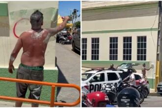 homem-preso-por-pichar-predios-com-simbolos-de-faccao-pinta-muro-diante-da-policia