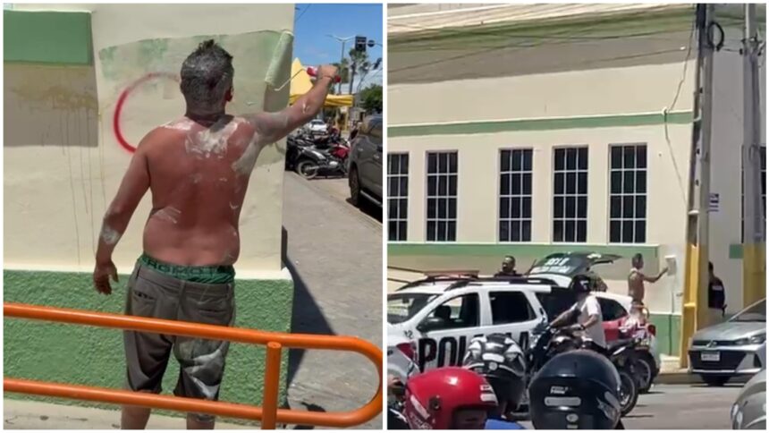 homem-preso-por-pichar-predios-com-simbolos-de-faccao-pinta-muro-diante-da-policia